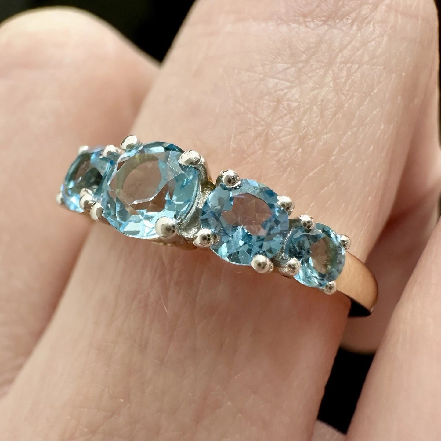 9Ct Yellow Gold Graduating Blue Topaz Ring Sz O 1/2