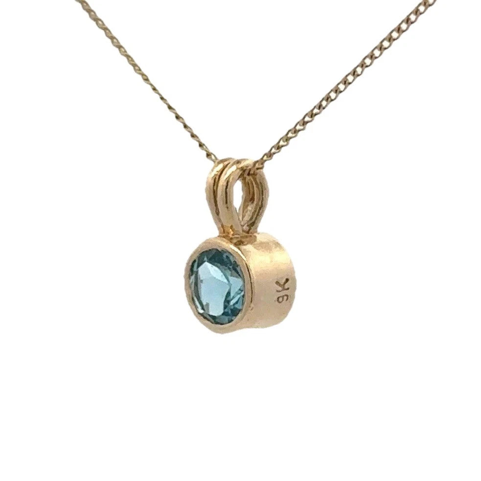 9Ct Yellow Gold Bezel Set Blue Topaz Solitaire Pendant
