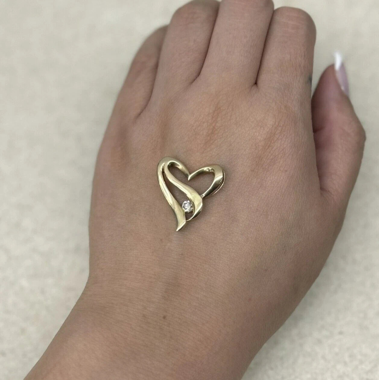 9Ct Yellow Gold 0.24 Carat TW Diamond Accent Heart Pendant