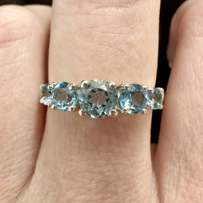 9Ct Yellow Gold Graduating Blue Topaz Ring Sz O 1/2