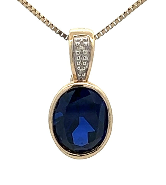 9Ct Yellow Gold & Created Blue Gemstone Pendant